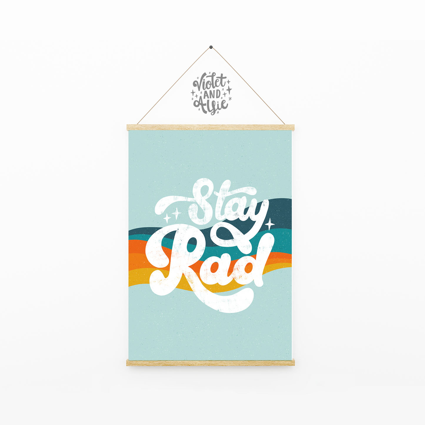 Stay Rad  This retro, seventies inspired wall art features funky hand lettered positivity and a gorgeous on-trend rainbow stripe in either a vintage blue and orange mix or pink and blue mix. This bold eye-catching print is perfect for adding to a retro themed bedroom (thank you Stranger Things) or a vibrant gallery wall display.